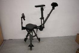 AN IDLEBACK ADJUSTABLE REVOLVING SHOOTING CHAIR WITH COMFORT SEAT