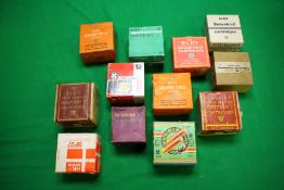 TWO BOXES CONTAINING AN ASSORTMENT OF 12 GAUGE VINTAGE CARTRIDGES TO INCLUDE ELEY GRAND PRIX,