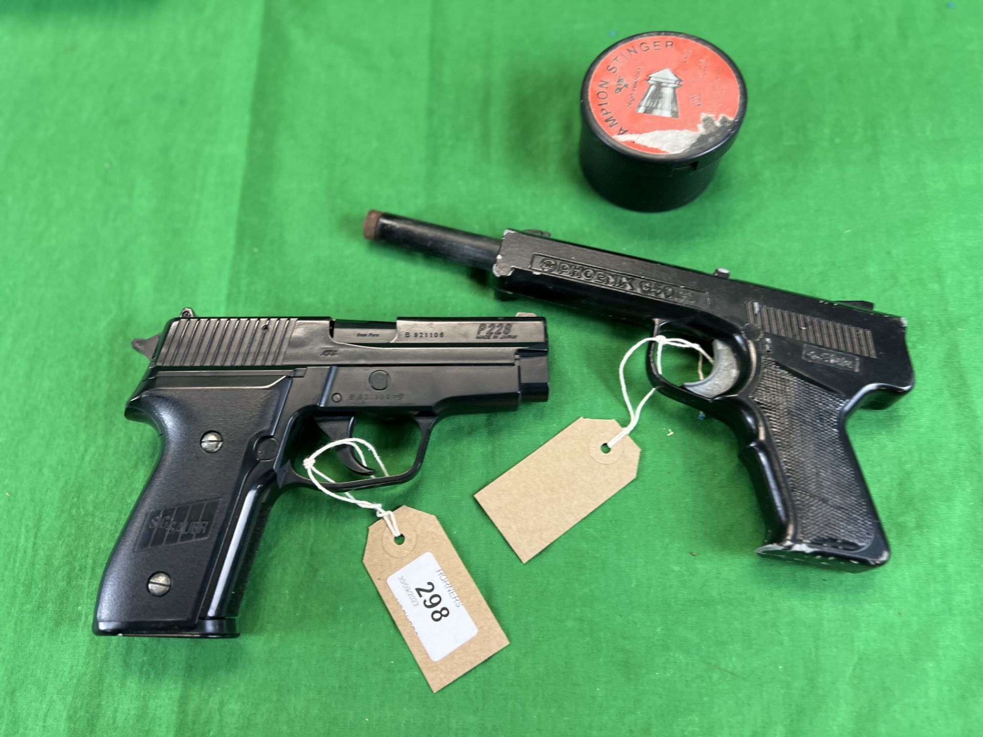 A SIG SAUER P228 BB GUN WITH BB's ALONG WITH PHOENIX G50 .