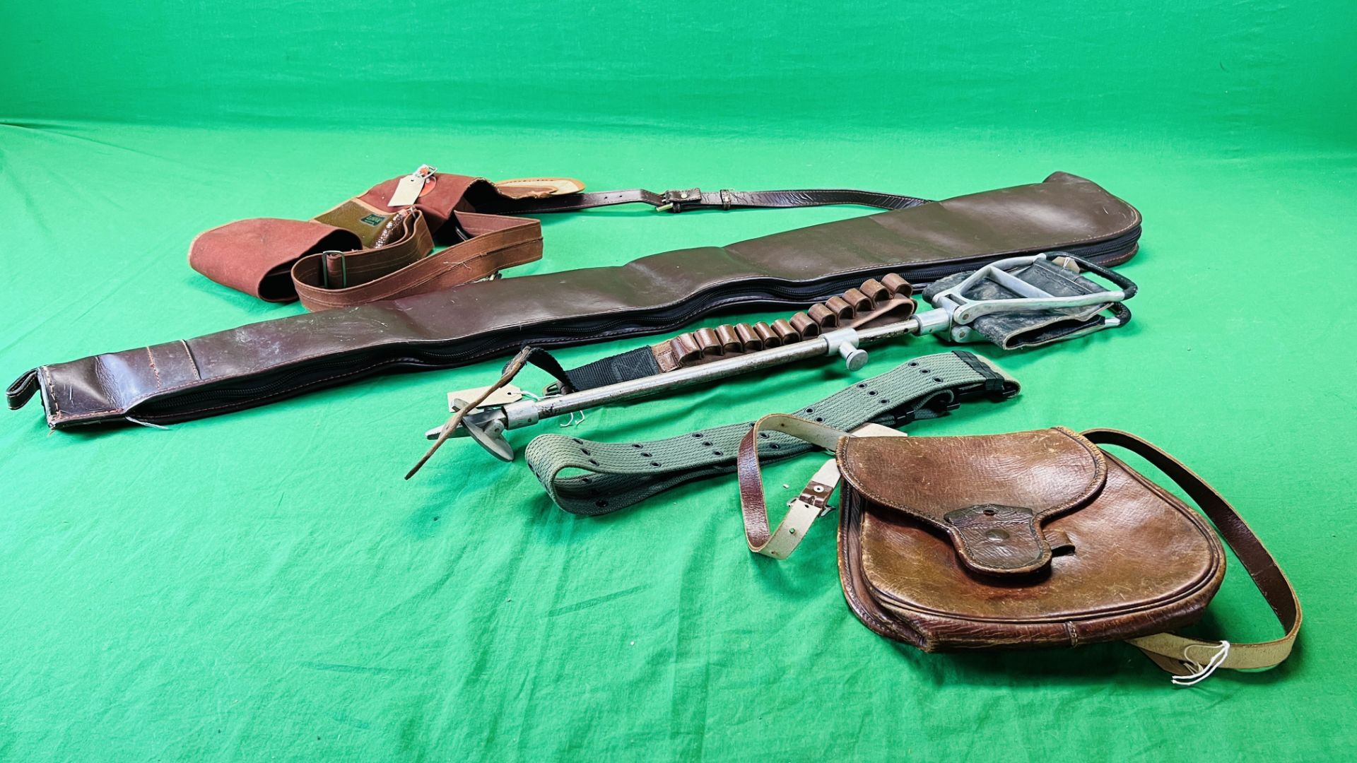 A GOOD QUALITY BROWN LEATHER SHOTGUN SLIP ALONG WITH LINDOP CANVAS SHOTGUN SLIP,