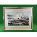 A FRAMED PRINT DEPICTING DUCKS IN FLIGHT BEARING PENCIL SIGNATURE DAVID HAGERBAUMER,