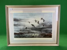 A FRAMED PRINT DEPICTING DUCKS IN FLIGHT BEARING PENCIL SIGNATURE DAVID HAGERBAUMER,