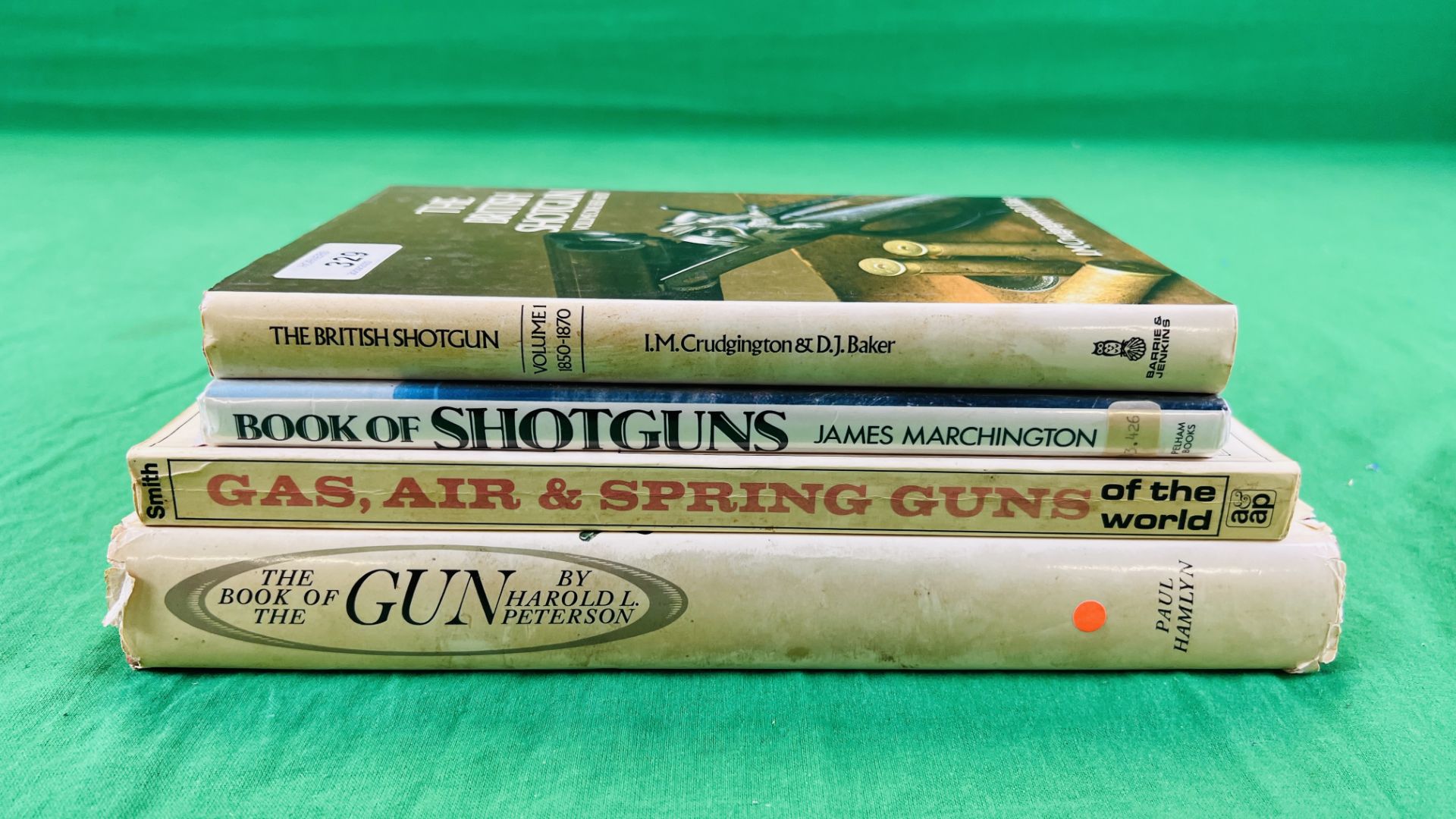 FOUR BOOKS RELATING TO GUNS TO INCLUDE EXPERTS ON GUNS AND SHOOTING - G.T.