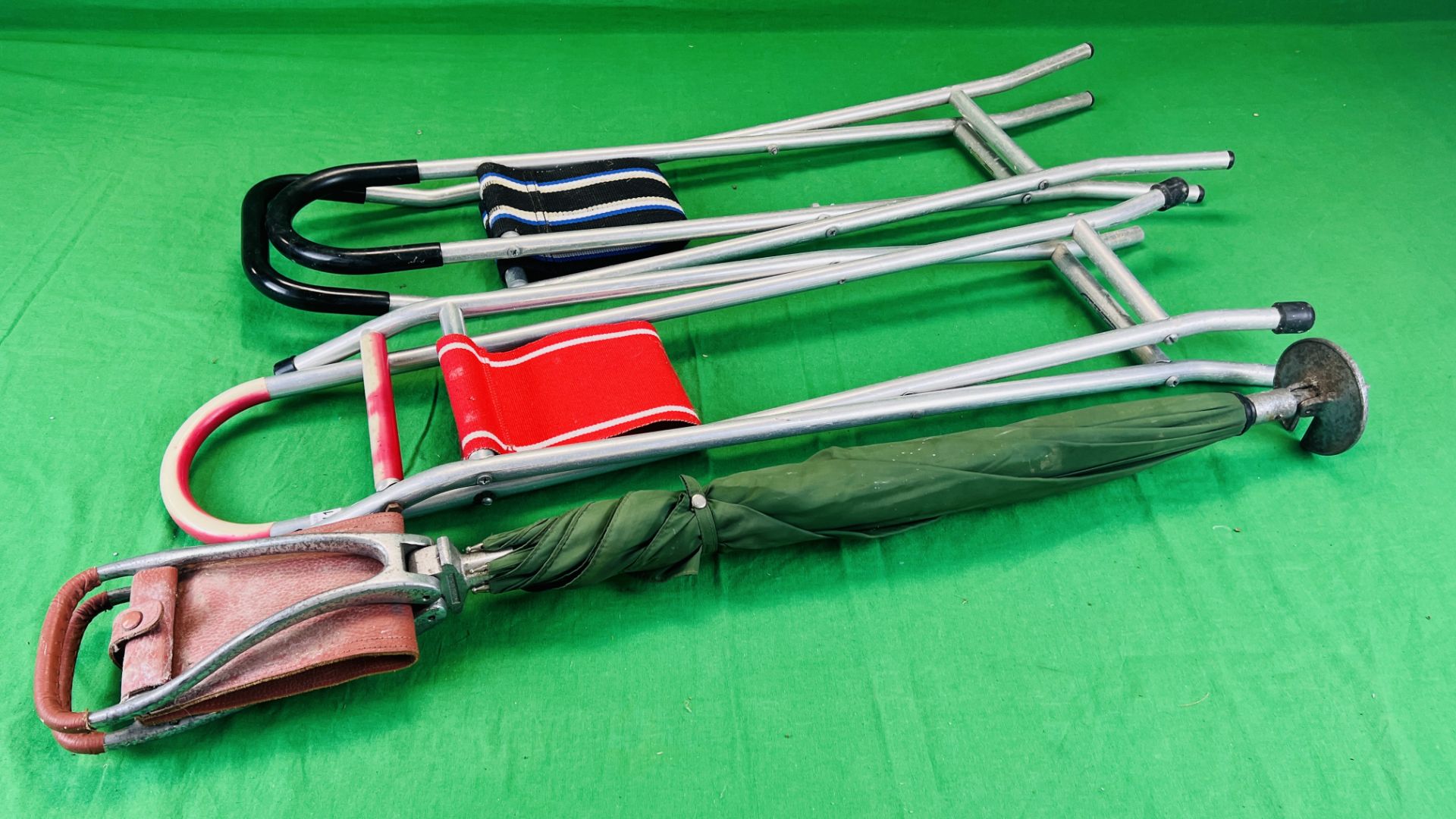 A UMBRELLA SHOOTING STICK ALONG WITH TWO ALUMINIUM FOLDING SEATS