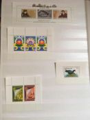 NETHERLANDS ANTILLES AND SURINAM: 1955-97 MNH COLLECTION IN TWO STOCKBOOKS, VENDOR STATES CAT.