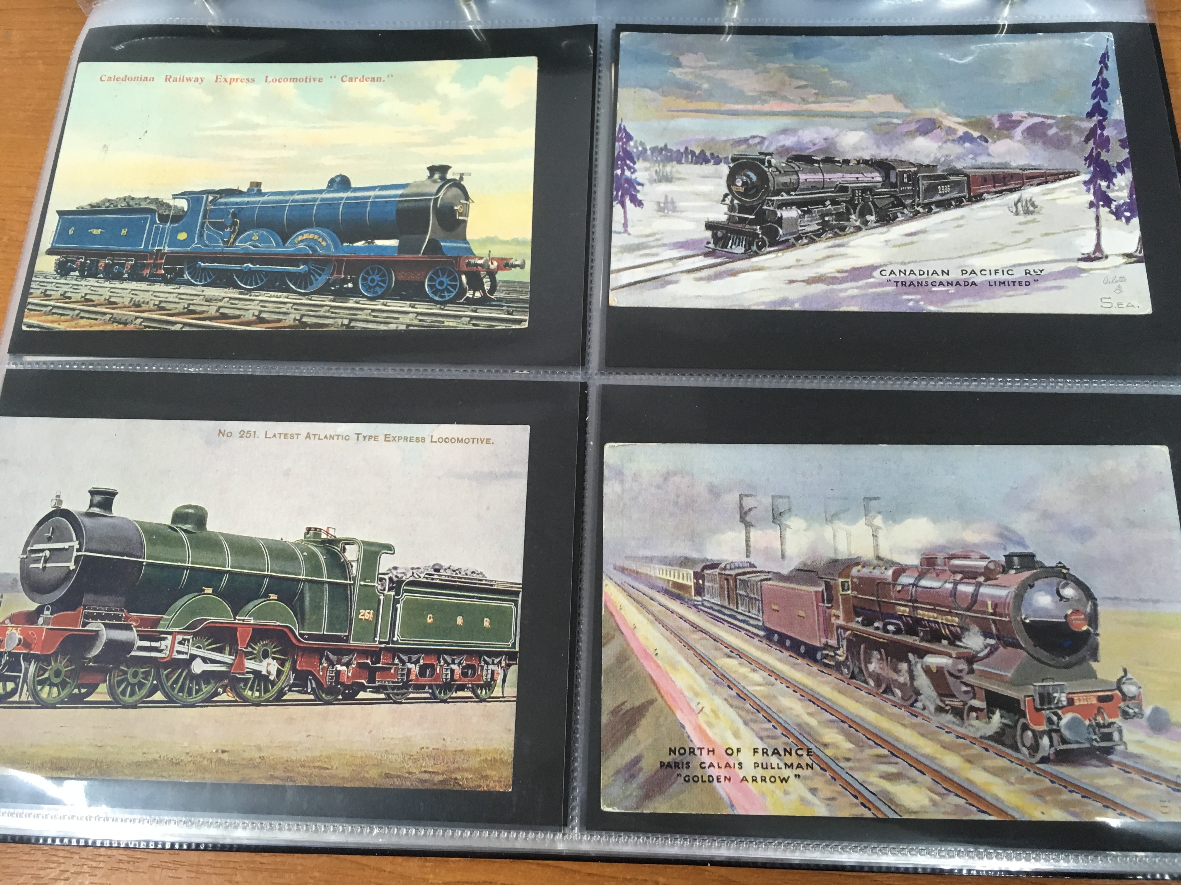 ALBUM WITH RAILWAY POSTCARDS, MAINLY COLOURED WITH MANY POSTALLY USED,
