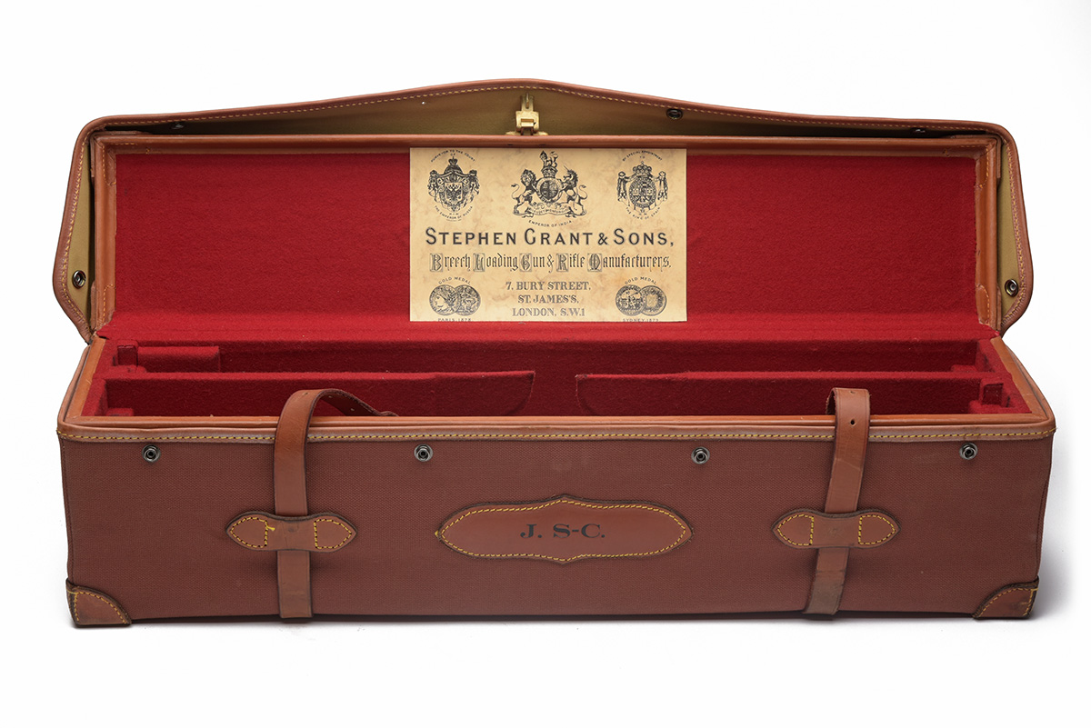 A LEATHER DOUBLE MOTORCASE WITH CANVAS OUTER, fitted for 27in. barrels, the interior lined with