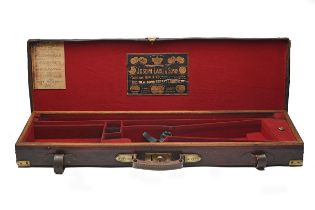 A BRASS-CORNERED OAK AND LEATHER SINGLE GUNCASE, fitted for 30in. barrels, the interior lined with