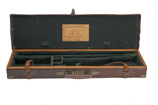 STEPHEN GRANT & JOSEPH LANG LTD. A BRASS-CORNERED OAK AND LEATHER SINGLE GUNCASE, fitted for 30in.