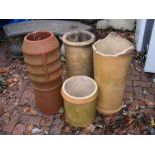 A terracotta chimney pot together with three other
