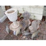 A selection of garden ornaments including otter