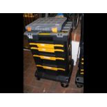A Dewalt toolbox on wheeled stand, together with t