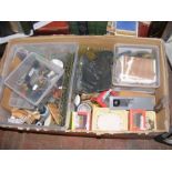 A box of Hornby model train accessories etc.