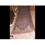 A Middle Eastern hall rug with floral border - 307