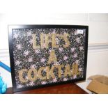 A framed and glazed 'Life's a Cocktail' picture collage