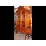 An antique style two door display cabinet with sin