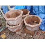 Four octagonal garden plant pots