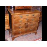 An 18th century walnut chest of four long graduate