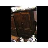 A Victorian mahogany linen press with panelled doo