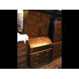 A period walnut bureau cupboard, the fall front bu