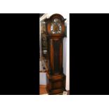 A 1930's oak cased Grandfather clock with three tr