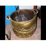 A decorative two handled brass coal scuttle - 42cm