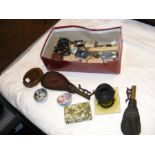 A box of various collectables including shot flask