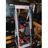 An assortment of clamps on clamp stand