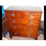 An antique mahogany chest of two short and three l