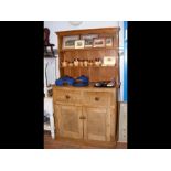 An antique pine kitchen dresser - width 113cms