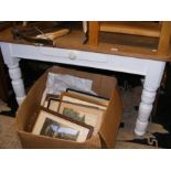 A farmhouse kitchen table on painted white support