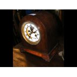 A mantel clock with visible escapement - 22cm high