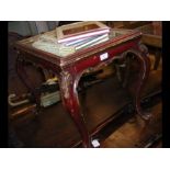 An antique painted occasional table with mirrored