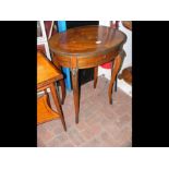 A small oval French side table with marquetry top
