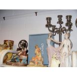 A medley of collectables, including Lladro and Coa