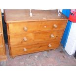 A Victorian pine chest of three long drawers