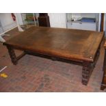 A large antique refectory style dining table with