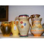 A quantity of collectable jugs, including Empire w