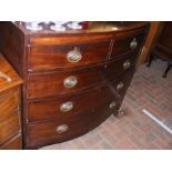 A 19th century bow fronted chest of two short and