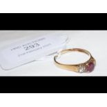 A ruby and diamond dress ring in 9ct setting