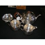 A three piece silver tea set by R & W Sorley (London, 1936) comprising tea pot, milk jug and sugar b