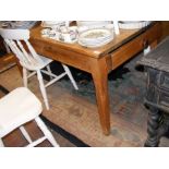 A stripped pine farmhouse kitchen table