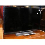 A Toshiba 32 inch LCD colour TV - complete with po