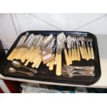 A tray of old cutlery bearing silver collars