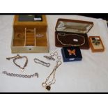 A box of costume jewellery including 9ct gold rings