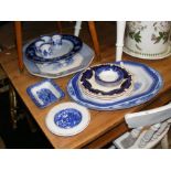 An assortment of blue and white meat platters, pla