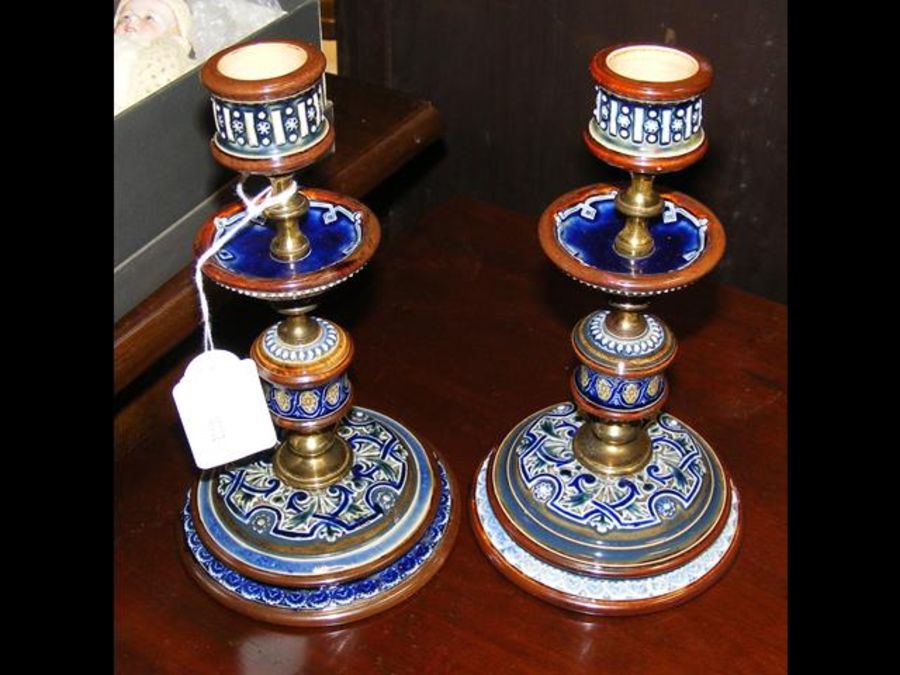 A pair of Doulton Lambeth blue glazed candlesticks