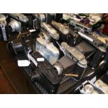 A tray of vintage cameras including Konica