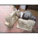 Assorted garden ornaments including two lions