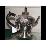 A silver baluster teapot - Chester 1913